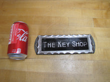 Load image into Gallery viewer, THE KEY SHOP Antique Reverse on Chip Scalloped Glass Advertising Sign ROG