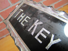 Load image into Gallery viewer, THE KEY SHOP Antique Reverse on Chip Scalloped Glass Advertising Sign ROG