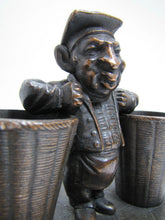 Load image into Gallery viewer, Man with Baskets Old Figural Match Holders Double Matchstick Striker Art