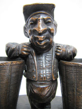 Load image into Gallery viewer, Man with Baskets Old Figural Match Holders Double Matchstick Striker Art