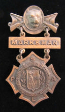 Load image into Gallery viewer, REMINGTON ARMS UNION METALLIC CARTRIDGE Co MARKSMAN Antique Pin Medallion D&C NY