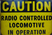 Load image into Gallery viewer, CAUTION RADIO CONTROLLED LOCOMOTIVE IN OPERATION Old Porcelain Sign RR Train