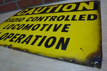 Load image into Gallery viewer, CAUTION RADIO CONTROLLED LOCOMOTIVE IN OPERATION Old Porcelain Sign RR Train