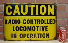 Load image into Gallery viewer, CAUTION RADIO CONTROLLED LOCOMOTIVE IN OPERATION Old Porcelain Sign RR Train