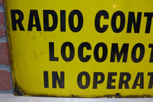 Load image into Gallery viewer, CAUTION RADIO CONTROLLED LOCOMOTIVE IN OPERATION Old Porcelain Sign RR Train