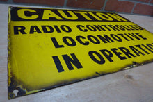 Load image into Gallery viewer, CAUTION RADIO CONTROLLED LOCOMOTIVE IN OPERATION Old Porcelain Sign RR Train