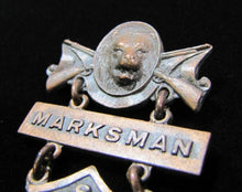 Load image into Gallery viewer, REMINGTON ARMS UNION METALLIC CARTRIDGE Co MARKSMAN Antique Pin Medallion D&C NY