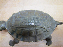 Load image into Gallery viewer, GRAND RAPIDS BRASS Co MICH Mfgr's Refrigerator &amp; Furniture Hdw Old Match Holder Figural Turtle Advertising
