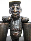 Load image into Gallery viewer, Man with Baskets Old Figural Match Holders Double Matchstick Striker Art
