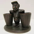 Load image into Gallery viewer, Man with Baskets Old Figural Match Holders Double Matchstick Striker Art
