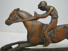 Load image into Gallery viewer, Vintage Jockey riding Horse Bookends brass copper wash ornate detailing rare htf
