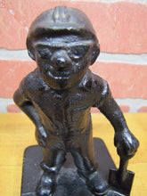 Load image into Gallery viewer, Old Cast Iron FOUNDRY WORKER COAL MINER Figural Doorstop Hat Goggles Shovel

