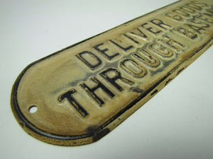 Old DELIVER GOODS THROUGH BASEMENT Sign embossed tin metal store advertising