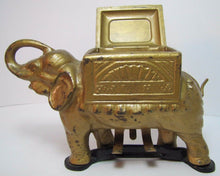 Load image into Gallery viewer, Old Cast Iron Elephant Cigarette Dispenser &#39;pat pend&#39; tail roller orig gold blk
