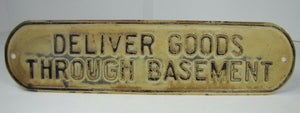 Old DELIVER GOODS THROUGH BASEMENT Sign embossed tin metal store advertising