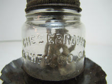Load image into Gallery viewer, Antique MAKE-DO OIL LAMP Tin Base Glass Bottle CHEESEBROUGH Mfg Co NEW YORK
