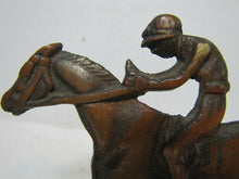 Load image into Gallery viewer, Vintage Jockey riding Horse Bookends brass copper wash ornate detailing rare htf
