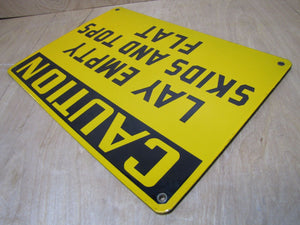 CAUTION LAY EMPTY SKIDS AND TOPS FLAT Old Porcelain Sign Yellow Black Industrial