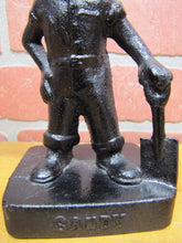 Load image into Gallery viewer, Old Cast Iron FOUNDRY WORKER COAL MINER Figural Doorstop Hat Goggles Shovel
