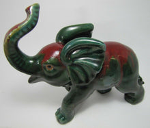 Load image into Gallery viewer, Old Art Pottery Elephant wonderful artwork green dp red glaze trunk up charging
