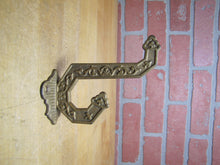 Load image into Gallery viewer, Antique Eastlake Double Hook Hanger Bracket Hardware Cast Iron Old Gold Paint
