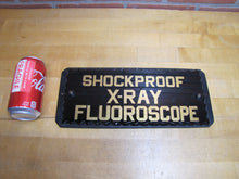 Load image into Gallery viewer, SHOCKPROOF X-RAY FLOUROSCOPE c1930s ROG Reverse On Chip Scallop Edge Glass Sign
