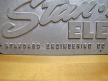 Load image into Gallery viewer, STAN-HOIST ELEVATOR Old Embossed Metal Advertising Sign Plaque STANDARD ENGINEERING Co FORT DODGE IOWA
