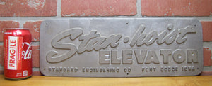 STAN-HOIST ELEVATOR Old Embossed Metal Advertising Sign Plaque STANDARD ENGINEERING Co FORT DODGE IOWA