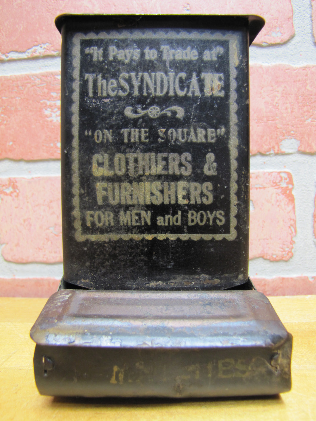 SYNDICATE ON THE SQUARE CLOTHIERS & FURNISHERS FOR MEN and BOYS Antique Advertising Tin Match Holder